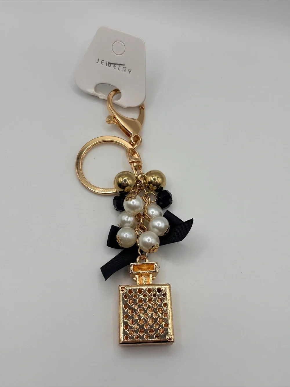 Gold Perfume Bottle Keychain with Black Bow and Pearls